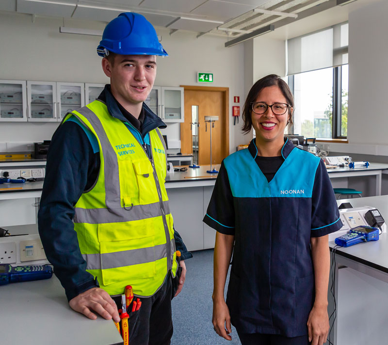technical-services-and-cleaning A cleaning operative and technical services technician together in a classroom